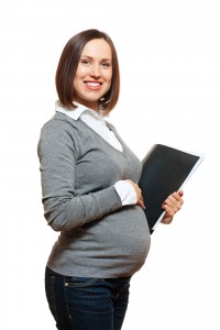 bigstock-pregnant-businesswoman-at-work-24677195